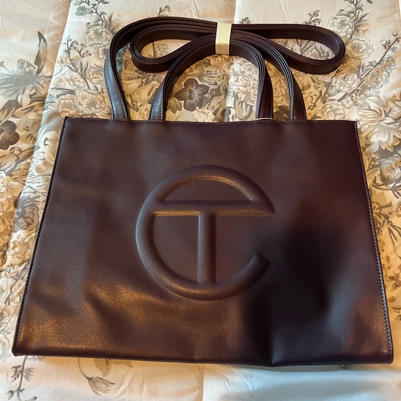 I have two brand new Tote bags for sale Telfar and Tory Burch with wristlet